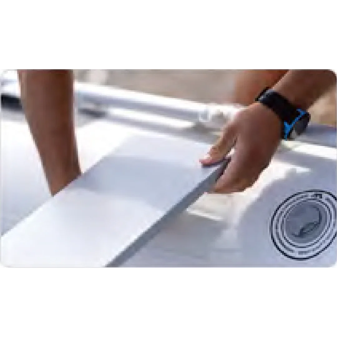 person attaching or adjusting fin on white inflatable Aqua Marina Deluxe air deck paddleboard